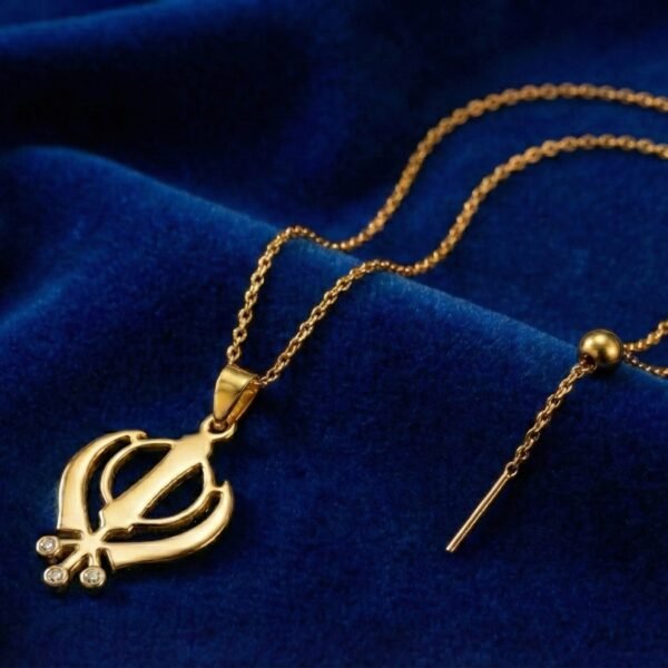 18K Gold Plated Khanda Pendant with three stones on blue velvet background.